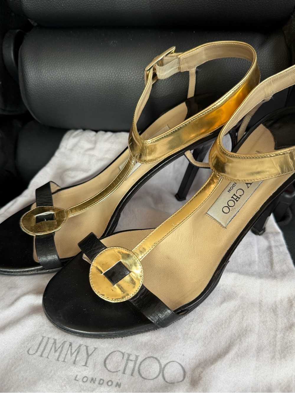 Jimmy Choo Black and Gold Leather T-Strap Heels